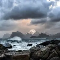 A powerful storm brews over the rugged Lofoten coastline, capturing Norway's dramatic natural beauty.