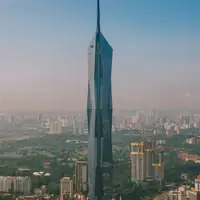 Aerial view of Merdeka 118, the iconic skyscraper in Kuala Lumpur's cityscape.